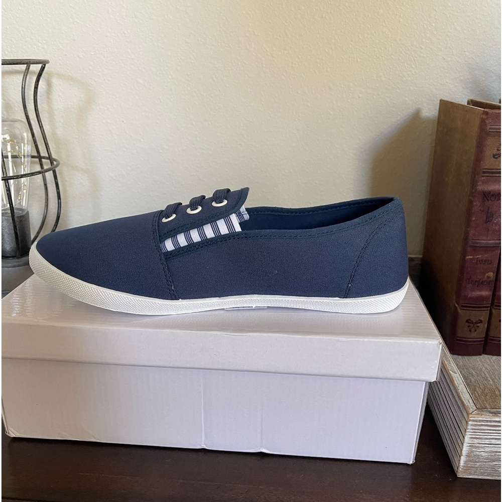 Women’s size 8 Navy slip-on shoes.
